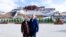 U.S. Ambassador to China Terry Branstad and his wife Christine pose for a photo in front of the Potala Palace in Lhasa in western China's Tibet Autonomous Region. 