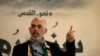 TOPSHOT - (FILES) Hamas' leader in the Gaza Strip Yahya Sinwar speaks during a press conference for Quds (Jerusalem) day in Gaza City on 30 May 2019.