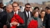 FILE - British Charge d'Affaires Tom Dodd and U.S. Ambassador Lynne Tracy attend a ceremony by ambassadors in memory of the victims of the terror attack in Krasnogorsk, outside Moscow, March 30, 2024. Russian propaganda has tried to link Ukraine and the U.S. to the attack.