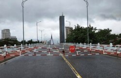 An empty street is barricaded ahead of Typhoon Molave in Da Nang, Vietnam, Oct. 28, 2020.