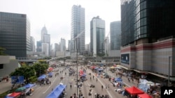 An aerial view shows a thinned crowd of pro-democracy student protesters continuing to occupy the streets around the government complex in Hong Kong, Thursday, Oct. 2, 2014.