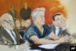 In this courtroom artist's sketch, defendant Jeffrey Epstein, center, sits with attorneys during his arraignment in New York federal court, July 8, 2019.