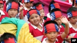 Young performers participate in the national day celebrations of the centennial anniversary of the founding of the Republic of China government in Taipei, Taiwan, October 10, 2011.