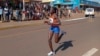 FILE -Rebecca Cheptegei, competes at the Discovery 10km road race in Kapchorwa, Uganda, Jan. 20, 2023.