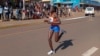 FILE - Rebecca Cheptegei competes at a 10 km road race in Kapchorwa, Uganda, Jan. 20, 2023.