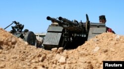 A member of Misrata forces, under the protection of Tripoli's forces, takes his position near a military camp in Tripoli, Libya, April 9, 2019.