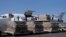 FILE - Workers unload an aid shipment from a plane at the Sanaa airport, Yemen, Nov. 25, 2017. 