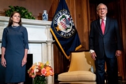 Judge Amy Coney Barrett, President Donald Trump's nominee to the Supreme Court, meets with Senate Majority Leader Mitch McConnell at the Capitol, September 29, 2020 in Washington.