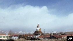 In this photo taken on Monday, Feb. 27, 2012, Stupa of Kirti monastery, the largest Tibetan monastery is seen in Aba prefecture, in China's Sichuan province. 