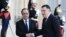 French President Francois Hollande (L) welcomes Prime Minister of Libya's Government of National Accord, Fayez al-Sarraj, upon his arrival at the Elysee Palace in Paris, Sept. 27, 2016.