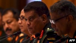 Sri Lanka's new army chief Lieutenant General Shavendra Silva (2R) looks on during a press conference in Colombo, Aug. 26, 2019. 