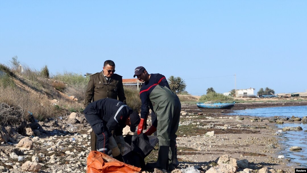 Coastguards retrieve a body, which according to them belongs to a migrant, in Sfax