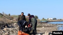 Coastguards retrieve a body, which according to them belongs to a migrant, in Sfax