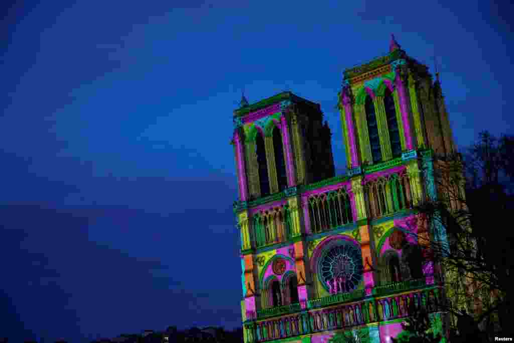 A light show rehearsal takes place on the facade of the Notre-Dame de Paris Cathedral, 5-and-a-half years after a fire ravaged the Gothic masterpiece, on the eve of reopening ceremonies in Paris, France.