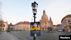 General view of the empty Neumarkt square during the local coronavirus disease (COVID-19) lockdown in Dresden, Germany, Dec. 14, 2020.
