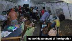 Malawi returnees screened at Mwanza border upon arrival from South Africa. (Courtesy: Pasqually Zulu/Immigration Departmentment)