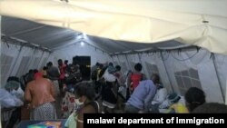 Malawi returnees screened at Mwanza border upon arrival from South Africa. (Courtesy: Pasqually Zulu/Immigration Departmentment)