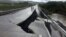 A damaged road is seen after a quake at Tarahuin, on Chiloe island, southern Chile, Dec. 25, 2016. 