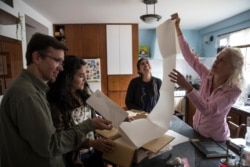 In this Feb. 18, 2019 photo, from left, scientists Luis Daniel Llambi, Cherry Andrea Rojas, Mariana Cardenas and Alejandra Melfo, prepare to study how temperatures and plant life are changing in the Andean ecosystem known as the paramos.