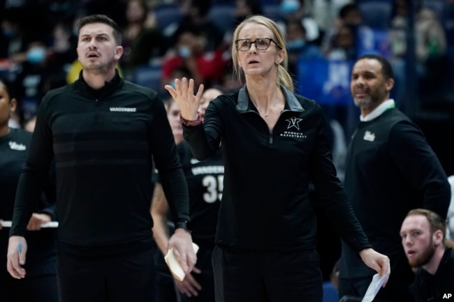 FILE - Many women are able to go to school and play sports at Vanderbilt University because of Title IX. Vanderbilt head coach Shea Ralph, center, at the women's Southeastern Conference tournament Wednesday, March 2, 2022, in Nashville, Tenn. (AP Photo/Mark Humphrey)