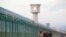 Workers walk by the perimeter fence of what is officially known as a vocational skills education centre in Dabancheng in Xinjiang Uighur Autonomous Region, China, on September 4, 2018. Reuters 
