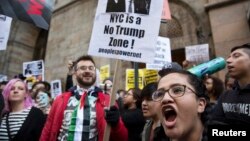 Protesters demonstrate against Republican U.S. presidential candidate Donald Trump in midtown Manhattan in New York City, April 14, 2016. 