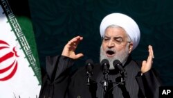 Iranian President Hassan Rouhani speaks during a ceremony celebrating the 41st anniversary of the Islamic Revolution, at Azadi (Freedom) Square in Tehran, Iran, Feb. 11, 2020.