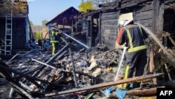 Vatrogasci na metsu napada u regionu Kijeva, (Foto: Handout / UKRAINIAN EMERGENCY SERVICE / AFP)