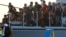 Migrants are seen onboard an Italian Coast Guard vessel following a rescue operation at the port on the Greek island of Kos, Aug. 16, 2015. 