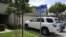 FILE - Vehicles are parked outside the home of Syed Raheel Farook, the elder brother of San Bernardino gunman Syed Rizwan Farook, after the FBI served a warrant to the location, in Corona, California, April 28, 2016. 