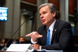 FILE - FBI Director Christopher Wray testifies on Capitol Hill, June 10, 2021.