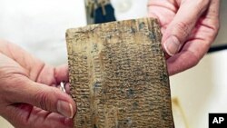 An ancient Persian tablet, about 2,500 years old, containing administrative details on the Persian empire, is seen at the Oriental Institute at the University of Chicago (file photo)