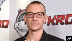 FILE - Chester Bennington poses at the 25th annual KROQ Almost Acoustic Christmas in Inglewood, Calif., Dec. 13, 2014. The Los Angeles County coroner says Bennington has died in his home near Los Angeles. He was 41. 