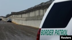 FILE - U.S. Border Patrol vehicles are patrol along the U.S. Mexico border area in San Diego, California, April 21, 2017. 