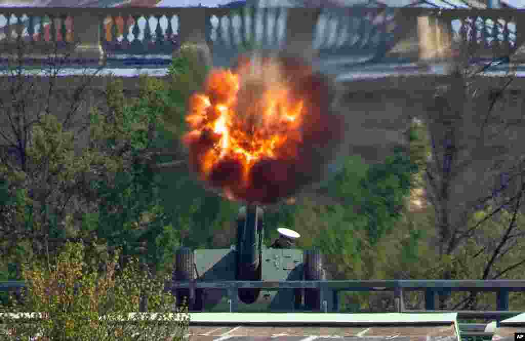 A Navy officer fires a cannon in the Saint Peter and Paul Fortress in St.Petersburg, Russia.