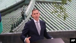 In this photo released by Australian Treasury, Australia's Federal Treasurer Jim Chalmers speaks during a news conference in Beijing, Sept. 27, 2024. 