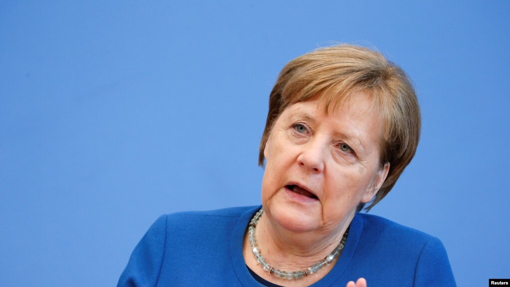 German Chancellor Angela Merkel gestures as she addresses a news conference on coronavirus in Berlin, Germany, March 11, 2020. REUTERS/Michele Tantussi