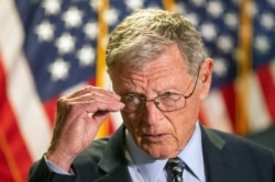 FILE - Senate Armed Services Committee Chairman James Inhofe, R-Okla., speaks to reporters on Capitol Hill, June 30, 2020.
