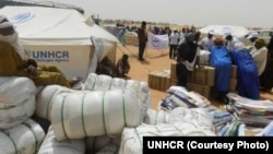 FILE - Mali refugees gather in the Mbera camp in Mauritania.