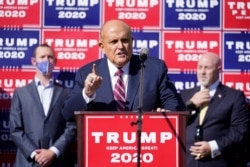 Former New York mayor Rudy Giuliani, a lawyer for President Donald Trump, speaks during a news conference on legal challenges to vote counting in Pennsylvania, November 7, 2020, in Philadelphia.