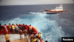 FILE PHOTO: Migrant onboard the NGO Proactiva Open Arms Uno rescue boat