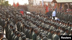 Venezuela's President Nicolas Maduro takes part in a ceremony at a Navy base in Catia La Mar, Venezuela May 14, 2019 in this handout picture from Miraflores Palace, May 14, 2019.