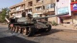 (FILE) A damaged army tank is seen on the street, almost one year into the war between the Sudanese Armed Forces and the paramilitary Rapid Support Forces (RSF), in Omdurman, Sudan, April 7, 2024.
