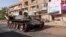 (FILE) A damaged army tank is seen on the street, almost one year into the war between the Sudanese Armed Forces and the paramilitary Rapid Support Forces (RSF), in Omdurman, Sudan, April 7, 2024.