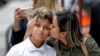 Sirley Silveira Paixao, an immigrant from Brazil seeking asylum, kisses her 10-year-old son Diego Magalhaes after he was released from immigration detention in Chicago, July 5, 2018. A U.S. Justice Department filing made hours before a hearing on July 6 in San Diego said the administration wouldn't be able to meet a judge's deadlines for reuniting all migrant families separated at the U.S.-Mexico border and would need more time in some instances. 