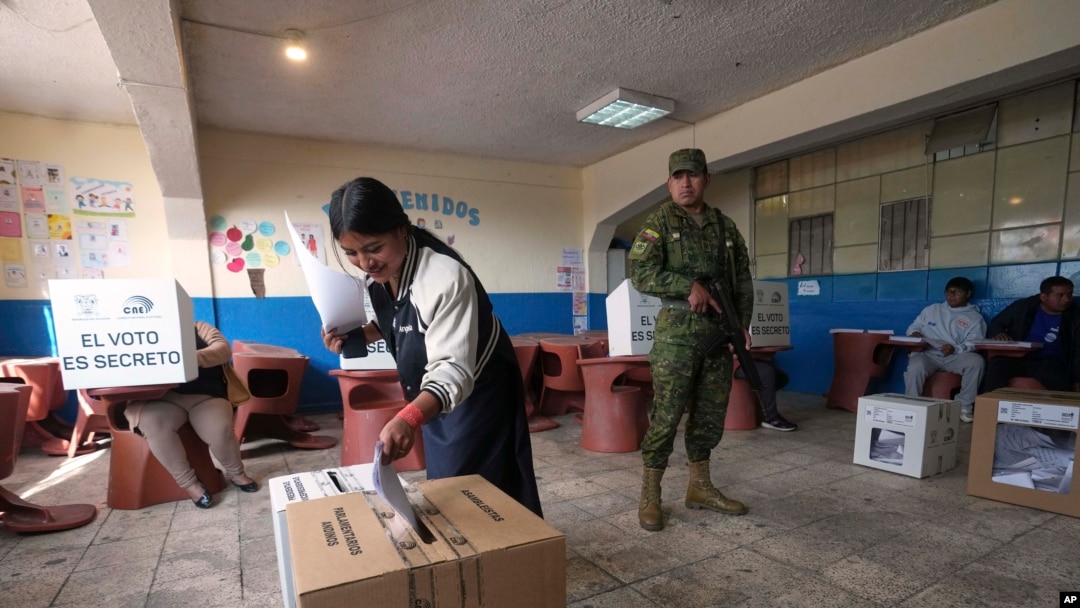 A voter casts her ballot during the presidential election in Quito, Ecuador, Feb. 9, 2025.