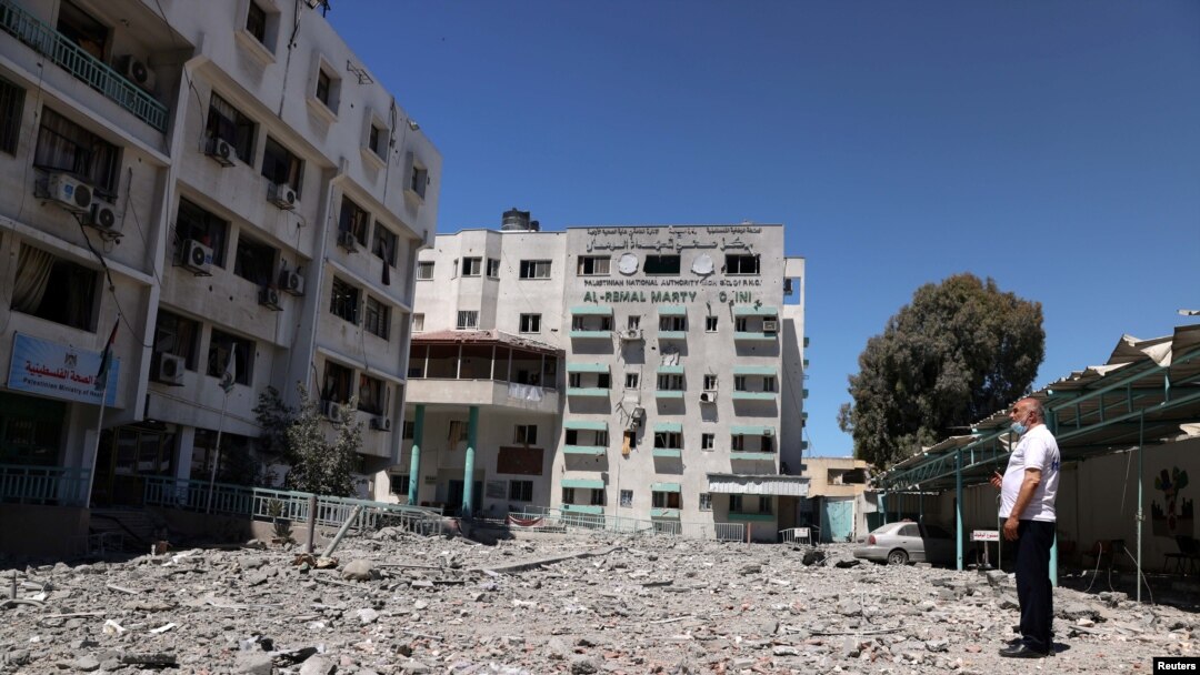 A Palestinian man views the damage to the health ministry headquarters in the aftermath of Israeli air strikes, in Gaza City May 19, 2021.