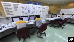 Technicians work at the Bushehr nuclear power plant, outside the southern city of Bushehr, Iran, August 23, 2010.