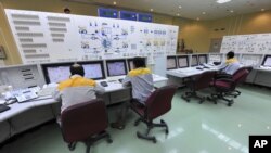 FILE - In this photo released by the International Iran Photo Agency, technicians work at the Bushehr nuclear power plant, outside the southern city of Bushehr.
