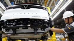 A man works at an assembly line of Vinfast Auto factory in Hai Phong city, Vietnam, June 14, 2019.